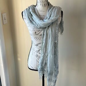 Express Scarf Wrap. Gray With Silver Metallic Boarder. Unfinished frayed edging.